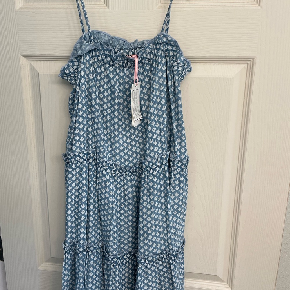 Adjustable straps, elastic at the top of dress.